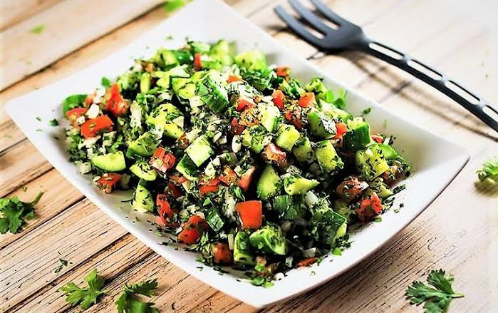 Salad Shirazi with diced cucumber, tomato, onion and herbs