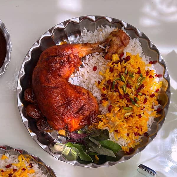Zereshk Polo ba Morgh with saffron rice, barberries and roasted chicken